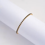 Pulsera Tenis Negra en Oro laminado 18k